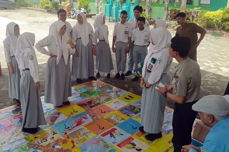 D:\2025\April 2025\23 april 2025\5\hal 5\Sejumlah pelajar SMAN 1 Gambut mengikuti sosialisasi dan simulasi.jpg