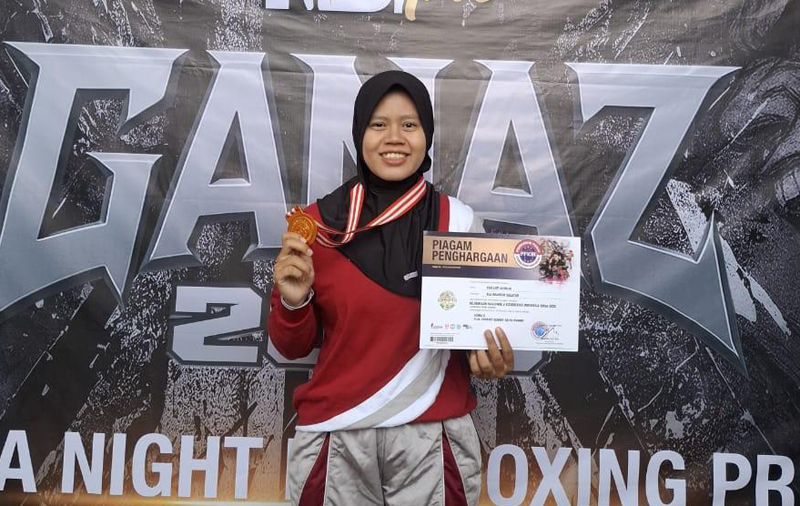 D:\2025\Desember 2025\4 Desember 2025\2\2222\New Folder\Atlet HSU Raih Medali Perunggu Kickboxing.jpg