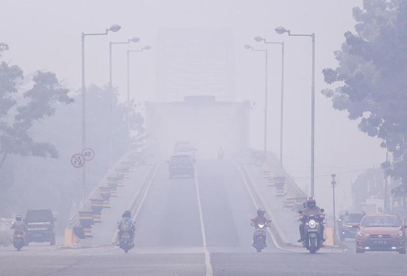 Pemerintah Diminta Padamkan Titik Api Kabut asap menyebar keseluruh daerah termasuk Kota Banjarmasin. (foto:mb/rds)